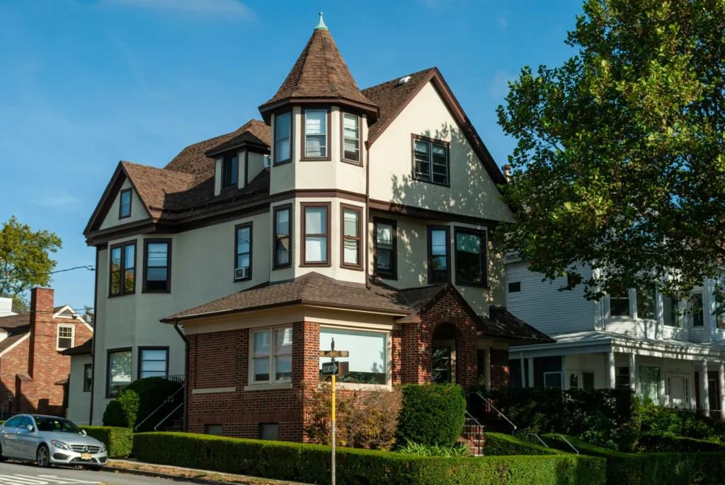 Spacious multi-story residential house with classic architecture and landscaped surroundings in New Jersey. Copy Alt Text